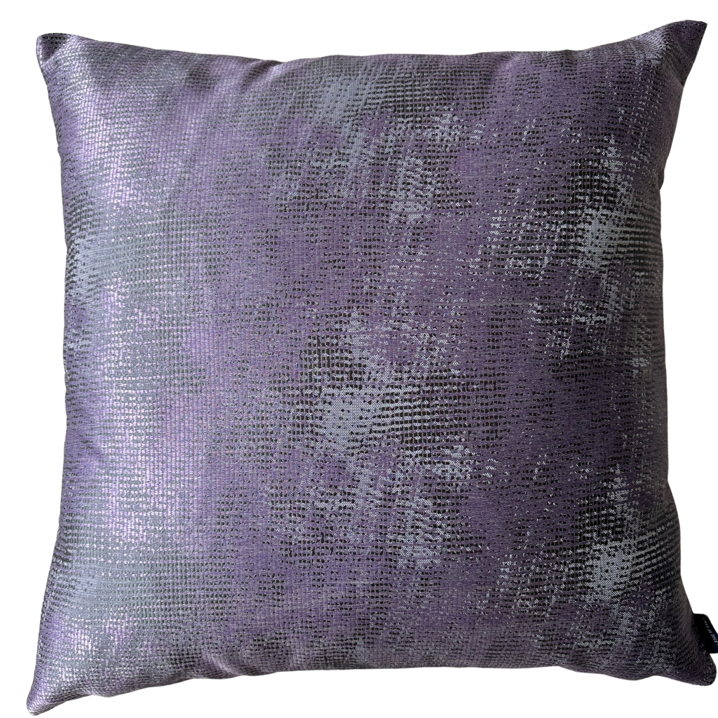 A square decorative throw pillow in a textured, metallic purple fabric with a subtle sheen, shown against a plain white background.